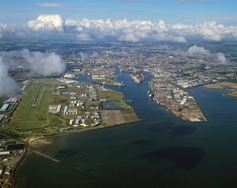 In this aerial view of Belfast Harbour's port estate note alongside on the left is the George Best Belfast City Airport, one of two that serve the Ulster capital. 