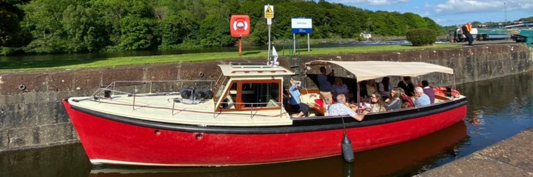 River at your leisure... guests on board MV Kingfisher on the River Bann, which is operated by the 75 year old veteran vessel built by Harland & Wolff
